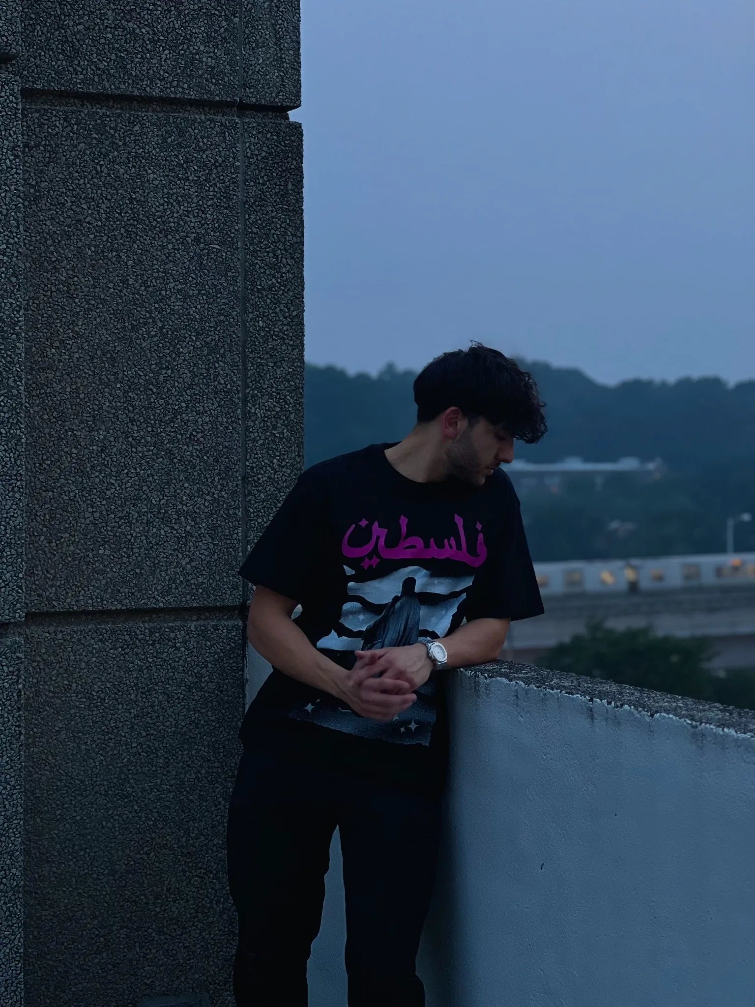 Close-up of Coal Palestine Graphic Tee showing high-GSM cotton fabric and bold Arabic typography details.