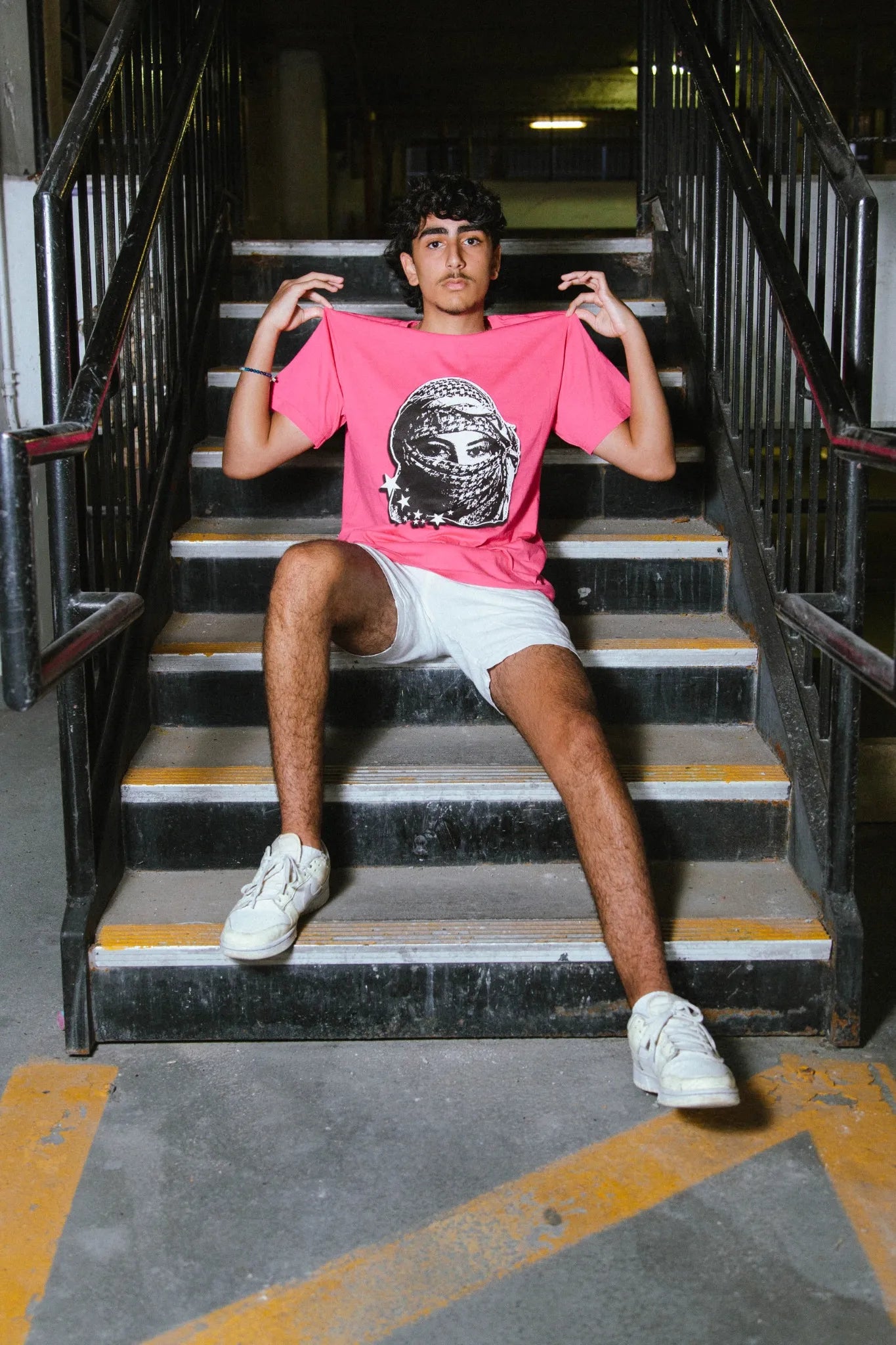 Palestinian streetwear Rose Kufiya Graphic Tee featuring Kufiya woman graphic and powerful solidarity message.